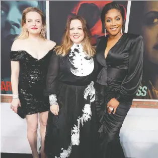  ?? REUTERS ?? Elisabeth Moss, left, Melissa Mccarthy and Tiffany Haddish play accidental Mob bosses in The Kitchen.