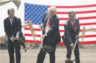  ?? EVAN VUCCI/AP FILE ?? President Donald Trump (center), then-Wisconsin Gov. Scott Walker (left) and then-Foxconn Chairman Terry Gou in a groundbrea­king event in Mt. Pleasant, Wisconsin, on June 28, 2018.