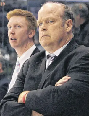  ?? CP PHOTO ?? London Knights general manager Mark Hunter, right, and assistant coach Jeff Paul, looks on during a break in second period action against the Edmonton Oil Kings at the Memorial Cup CHL tournament in London, Ont., Sunday, May 18, 2014.