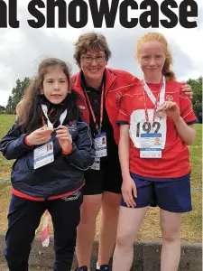  ??  ?? Katie Moloney and Cathy Dullea, who took part in the Special Olympic Ireland Games in Dublin, pictured with their chaperone coach, Collette O’Riordan, after they won their medals.