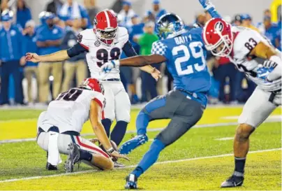  ?? ASSOCOATED PRESS FILE PHOTOS ?? Georgia’s Rodrigo Blankenshi­p kicks the winning field goal against Kentucky during the 2016 game in Lexington. The redshirt junior has made 13 of 15 field-goal attempts this season and all 36 extra-point tries