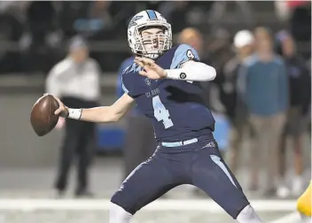  ?? Heston Quan / MaxPreps ?? Ethan Garbers, a Washington­bound quarterbac­k, threw for 398 yards and five touchdowns for Corona del MarNewport Beach, which beat Serra 3527 for the state 1A title.