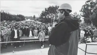  ?? CalArts Archive ?? AS CALARTS president, Lavine rallies students and faculty after the 1994 Northridge earthquake.