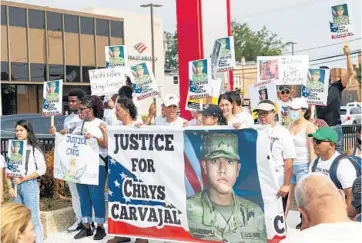  ?? VASHON JORDAN JR./CHICAGO TRIBUNE PHOTOS ?? Community members and the family of Chrys Carvajal, the 19-year old National Guard member killed over the July Fourth weekend, rally for peace Saturday in the Belmont-Cragin neighborho­od of Chicago.