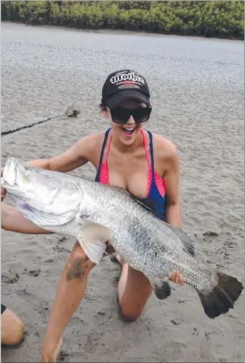  ??  ?? Darwin bombshell Sara Bolton landed this 113cm barra somewhere in Shoal Bay, courtesy of Sod’s Barra Safaris