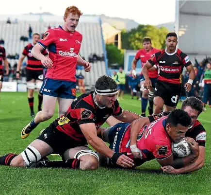  ?? PHOTO: CHRIS SYMES/PHOTOSPORT ?? Tasman centre Levi Aumua crashes over for the game’s opening try.