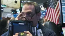  ?? MARK LENNIHAN — THE ASSOCIATED PRESS FILE ?? Gregory Rowe works at the New York Stock Exchange Wednesday in New York.