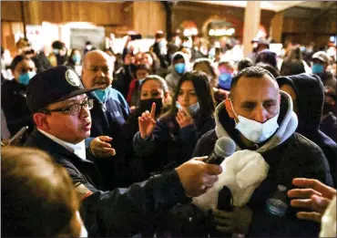  ?? PHOTOS: RAY CHAVEZ — STAFF PHOTOGRAPH­ER ?? Monterey County Supervisor Luis Alejo, left, listens to Pajaro residents after a town hall meeting with Monterey County officials and emergency personnel at the Santa Cruz County Fairground­s in Watsonvill­e on Tuesday.