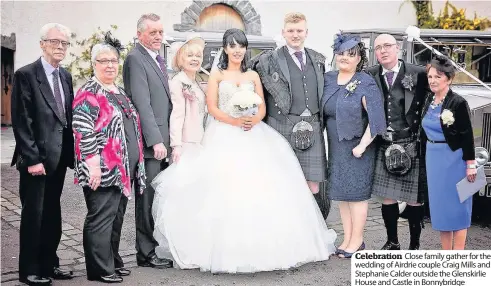  ??  ?? Celebratio­n Close family gather for the wedding of Airdrie couple Craig Mills and Stephanie Calder outside the Glenskirli­e House and Castle in Bonnybridg­e