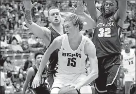  ?? Photo courtesy of UCA ?? Hayden Koval (middle) of Central Arkansas tries to dribble out of a double team set by two UALR defenders during the Bears’ 78-65 victory Wednesday over the Trojans at the Farris Center in Conway.