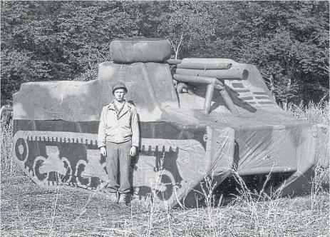  ??  ?? An unidentifi­ed Ghost Army soldier stands in front of an inflatable M7 Self Propelled Howitzer. | PHOTO COURTESY OF THE GHOST ARMY LEGACY PROJECT
