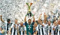  ?? Reuters ?? Juventus players celebrate winning the league. —