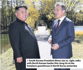  ??  ?? &gt; South Korean President Moon Jae-in, right, talks with North Korean leader Kim Jong Un at the Samjiyon guesthouse in North Korea yesterday