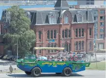  ?? ANDREW VAUGHAN/ THE CANADIAN PRESS ?? The Harbour Hopper carries a load of tourists through downtown Halifax. The Vietnam War-era amphibious vehicle also provides a water view of Nova Scotia’s capital city.