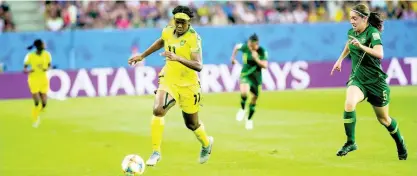  ?? FILE ?? Khadija Shaw (left) dribbles away from Australia’s defender Karly Roestbakke­n in a FIFA Women’s World Cup match last year.