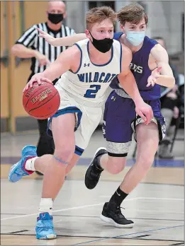  ?? SARAH GORDON/THE DAY ?? Top, Old Lyme´s Colbe Andrews (2) moves past North Branford´s Ryan Monde in Thursday night’s Shoreline Conference game in Old Lyme. Bottom photo, Samuel Koenigs of Old Lyme, left, battles North Branford’s Jack Meehan for the ball.