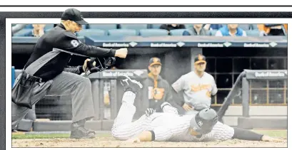  ?? Paul J. Bereswill ?? TAPPED OUT! Austin Romine is called out at home after Starlin Castro grounded into a fielder’s choice during the 10th inning of the Yankees’ 7-4, 11-inning loss to the Orioles on Sunday.