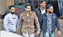  ?? SANJEEV VERMA/HT PHOTO ?? Actor Deep Sidhu in custody of Delhi Police special cell sleuths following his arrest from Karnal bypass on Monday night.