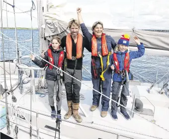  ?? PHOTO: ANDREW DOWNES ?? Adventurer­s’ return: Peter and Vera Quinlan-Owens with their children Ruairí and Lilian after completing their adventure of a lifetime sailing to the Caribbean and back.