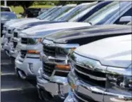  ?? THE ASSOCIATED PRESS ?? Chevrolet trucks are lined up at a Chevrolet dealership in Richmond, Va.