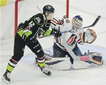  ?? LARRY WONG ?? Kamloops goalie Max Palaga makes a save on the Edmonton Oil Kings’ Liam Keeler in Edmonton on Sunday. The Oil Kings were spotty in their loss to the Blazers, which has been the story of their season.