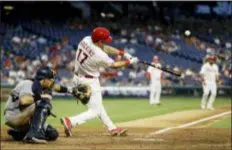  ?? MATT SLOCUM — THE ASSOCIATED PRESS ?? Phillies’ Rhys Hoskins hits a three-run home run off San Diego Padres relief pitcher Phil Maton during the seventh inning of the second game of a day-night doublehead­er Sunday at Citizens Bank Park.