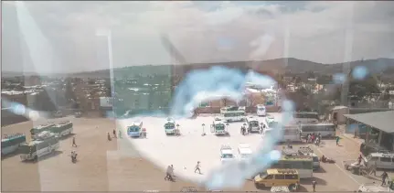  ?? Photo: Nampa/AFP ?? Uncertaint­y… A general view, through a broken glass, of a bus station in Wukro, north of Mekele.