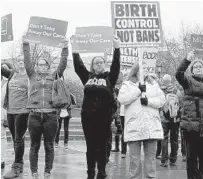 ?? DON SHRUBSHELL/ASSOCIATED PRESS ?? People gather to protest an effort to shut down abortions at one of two clinics performing them in Missouri.