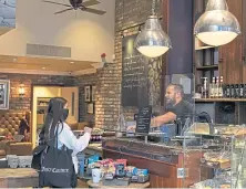  ??  ?? A Caffe Nero customer being served.