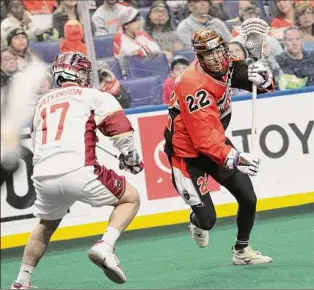  ?? Photo courtesy NLL ?? Buffalo Bandits forward Josh Byrne makes a move against the Albany FireWolves’ Colton Watkinson in their first-round playoff game on Saturday.