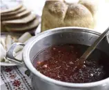  ?? Yomiuri Shimbun photos ?? Left: Volunteers prepare the ingredient­s to make borscht for sending in packages to soldiers on the front lines in IvanoFrank­ivsk, Ukraine, in early July. Above: Borscht simmered in a pot
