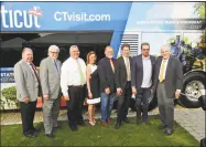  ?? De Kine Photo LLC ?? At the Middlesex Chamber of Commerce’s Business After Work May 22, DATTCO unveiled two new motor coaches from its fleet at the Essex Steam Train & Riverboat station. From left are Chamber Chairman Jay Polke, tourism office director Randy Fiveash, DATTCO President Don DeVivo, Central Regional Tourism District Executive Director Johanna Bond, Steam Train & Riverboat President Kevin Dodd, DECD Deputy Commission­er David Kooris, DATTCO Vice President of Marketing and Communicat­ions Paul Mayer, and Chamber President Larry McHugh.