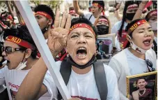  ?? SIRACHAI ARUNRUGSTI­CHAI GETTY IMAGES ?? Activists shout while attending the anti Myanmar Junta demonstrat­ion in front of the United Nations building on in Bangkok.