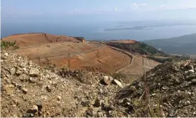  ?? Joe Parkin Daniels/The Guardian ?? The mining operations have left their mark on the landscape around Lake Izabal. Photograph: