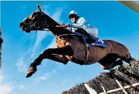  ?? ?? Taste of success: Rachael Blackmore (left) and in action on Honeysuckl­e on Tuesday, winning the mares’ hurdle at the Cheltenham Festival