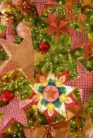  ??  ?? Instead of angels and tinsels, the Christmas tree is covered with “parol.”