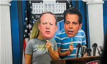  ?? PHOTO: REUTERS ?? Attendees at the Politicon conference in Pasadena, California pose for photos with cardboard masks of Anthony Scaramucci, right, and former White House press secretary Sean Spicer.