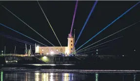  ?? ?? Lasers light up Scarboroug­h lighthouse.