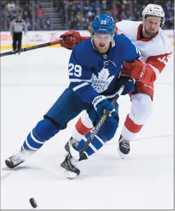  ?? THE CANADIAN PRESS/NATHAN DENETTE ?? Toronto Maple Leafs William Nylander (29) oulls away from Detroit Red Wings defenceman Niklas Kronwall (55) during second period NHL action in Toronto.