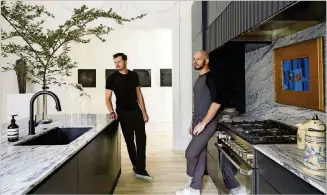  ??  ?? Owners of The Drawing Room, Daniel Zimmerman (left) and Seth van den Bergh, brought this home forward into the modern metropolit­an world while respecting its historical Midtown Atlanta roots.