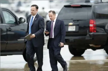  ?? ALEX BRANDON — THE ASSOCIATED PRESS ?? White House Director of Social Media Dan Scavino, left, walks with former White House Chief of Staff Reince Priebus after stepping off Air Force One as they arrive Friday at Andrews Air Force Base, Md. Trump says Homeland Secretary John Kelly is his...