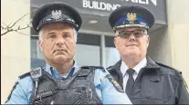  ??  ?? Bill Perivolari­s, left, a longtime TTC special constable, performed first aid at the scene Monday. He is pictured with Mike Killingswo­rth, head of transit enforcemen­t at the TTC.