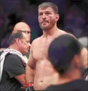  ?? TIM PHILLIS — THE NEWS-HERALD ?? Stipe Miocic looks on after being knocked out by new UFC heavyweigh­t champion Daniel Cormier on July 7.