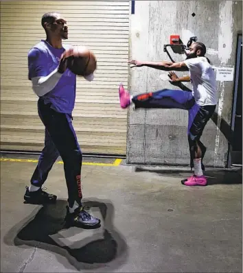  ?? Robert Gauthier Los Angeles Times ?? CLIPPERS guards Russell Westbrook, left, and James Harden warm up before Game 1 of the NBA Western Conference playoffs Sunday at Crypto.com Arena. A stingy defense helped the Clippers defeat Dallas.