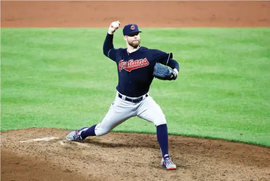  ??  ?? Cleveland Indians starting pitcher Corey Kluber throws to the Baltimore Orioles in the ninth inning of a baseball game in Baltimore on Monday. (AP)