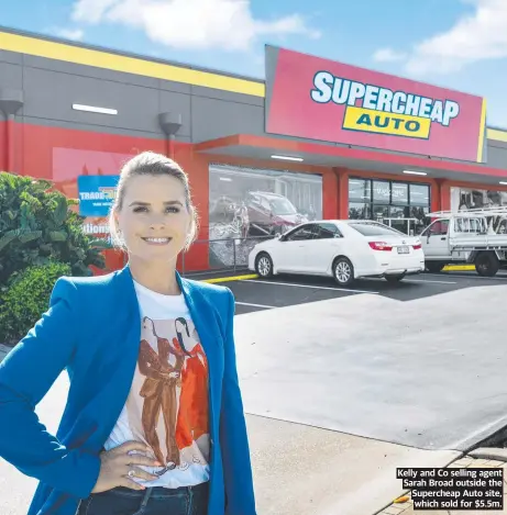  ?? ?? Kelly and Co selling agent Sarah Broad outside the Supercheap Auto site, which sold for $5.5m.