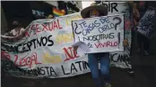  ?? ARIANA CUBILLOS — THE ASSOCIATED PRESS ?? Women from the feminist group “Tinta Violeta” march during a protest marking Internatio­nal Women’s Day and demanding justice for women who have been victims of violence in Caracas, Venezuela, Monday.