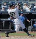  ?? SETH WENIG — THE ASSOCIATED PRESS ?? New York Yankees' Aaron Judge looks after a two-run homer during the third inning of a baseball game against the Kansas City Royals at Yankee Stadium, Monday in New York. It was Judge's 49th home run, which ties the MLB rookie home run record.