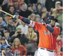  ?? ELISE AMENDOLA/THE ASSOCIATED PRESS ?? Red Sox’s David Ortiz hits a game-winning two-run home run off Toronto pitcher Brett Cecil on Friday.