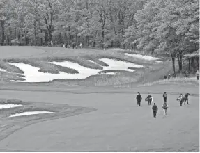  ?? PETER CASEY/USA TODAY SPORTS ?? Xander Schauffele walks on the fifth hole during a practice round Monday at Bethpage State Park’s Black Course.